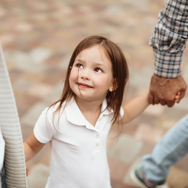Small girl enjoying time with parents