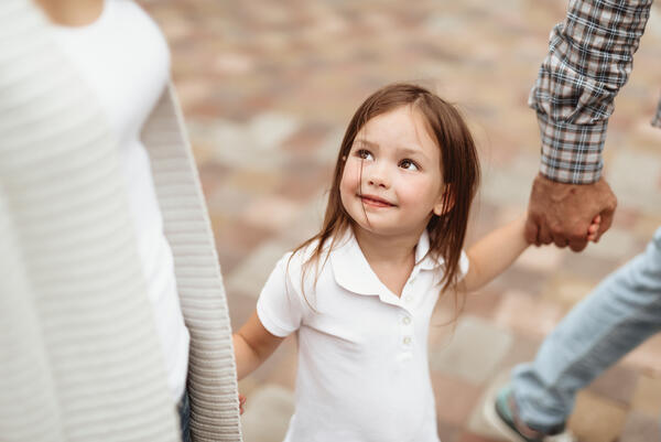 Small girl enjoying time with parents